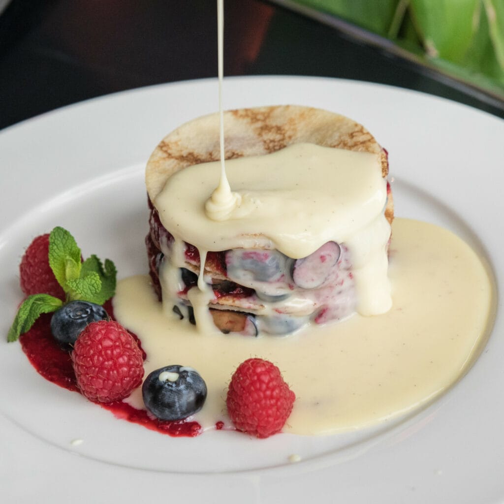 Pancakes with White Chocolate Sauce and Fresh Berries